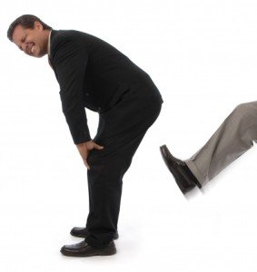 Man getting kicked in the behind Man getting kicked in the behind