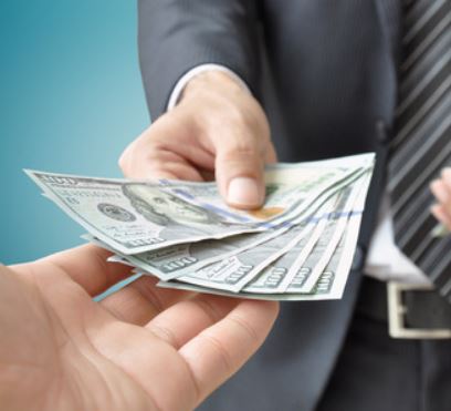 Hand Receiving Cash from Businessman