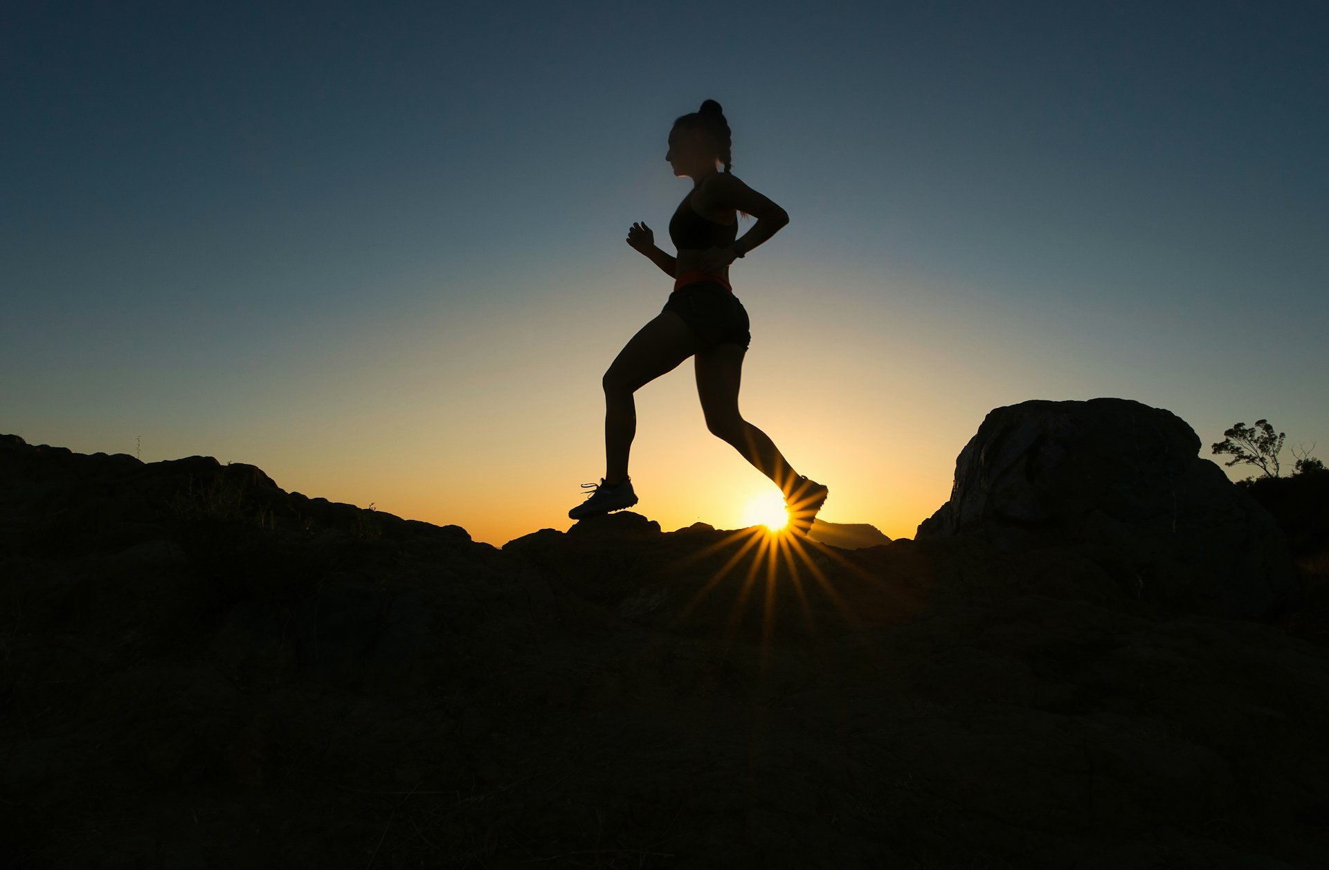 silhouette of woman running 