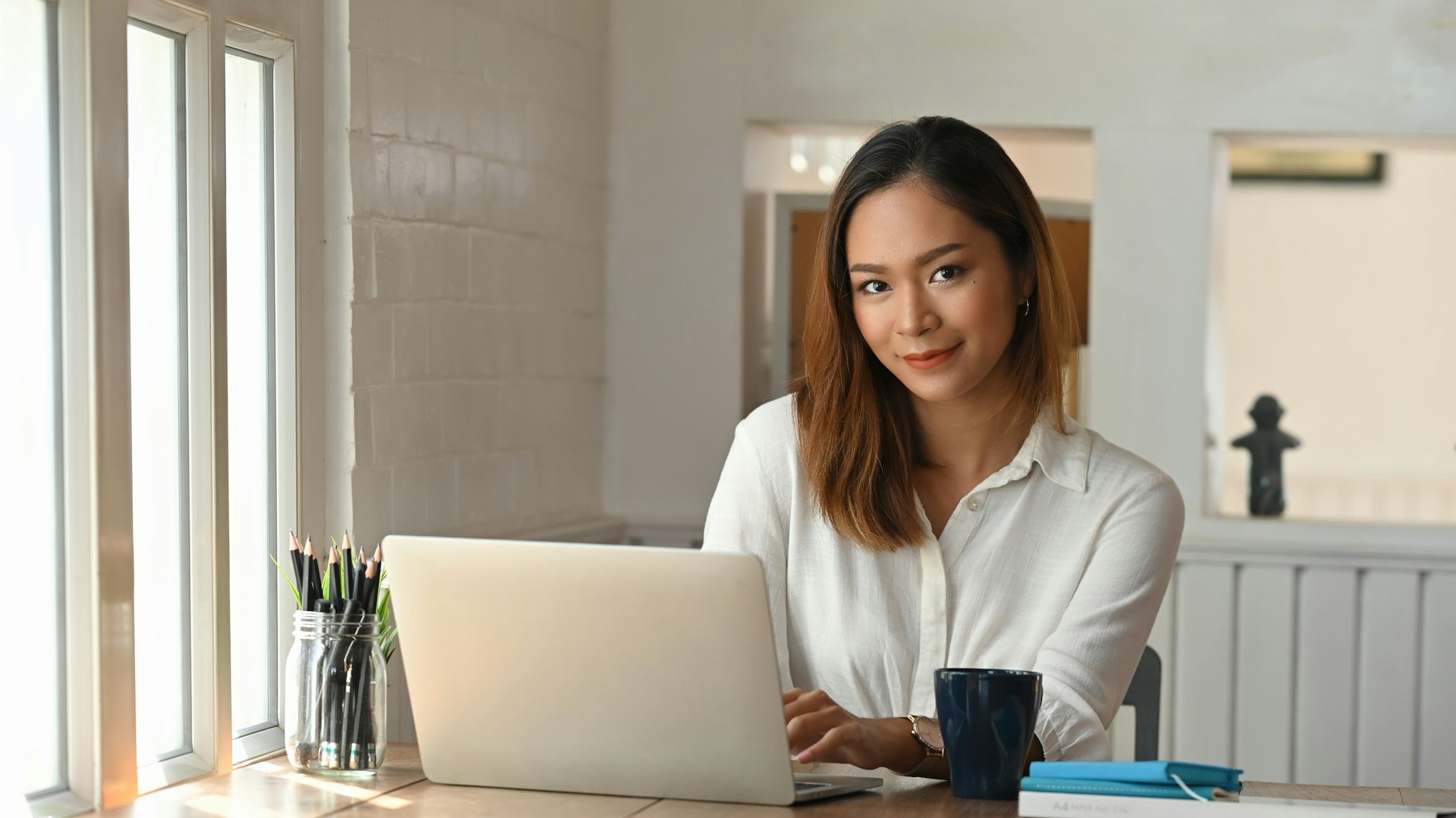 businesswoman working on laptop at home